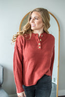 Model wearing henley sweater