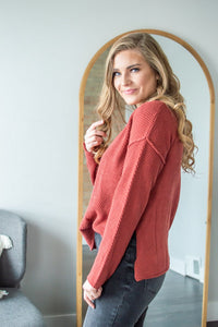 Model showing side view of henley sweater