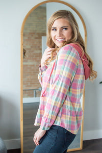 Side view of model wearing hooded flannel shirt.