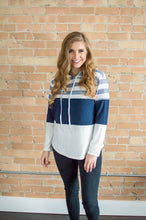 Load image into Gallery viewer, Model facing forward wearing striped hoodie
